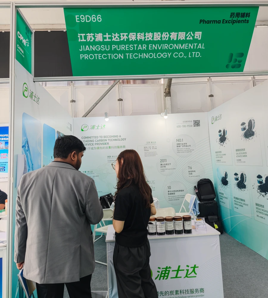 Purestar team presenting activated carbon samples to a visitor at Booth E9D66, CPHI China 2026